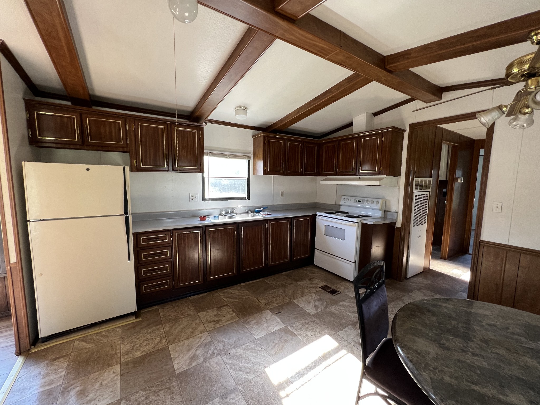 4225 Jernigan Road White House, TN 37188 - Photo 2 of 15 a kitchen with stainless steel appliances granite countertop a refrigerator a sink a stove and a microwave
