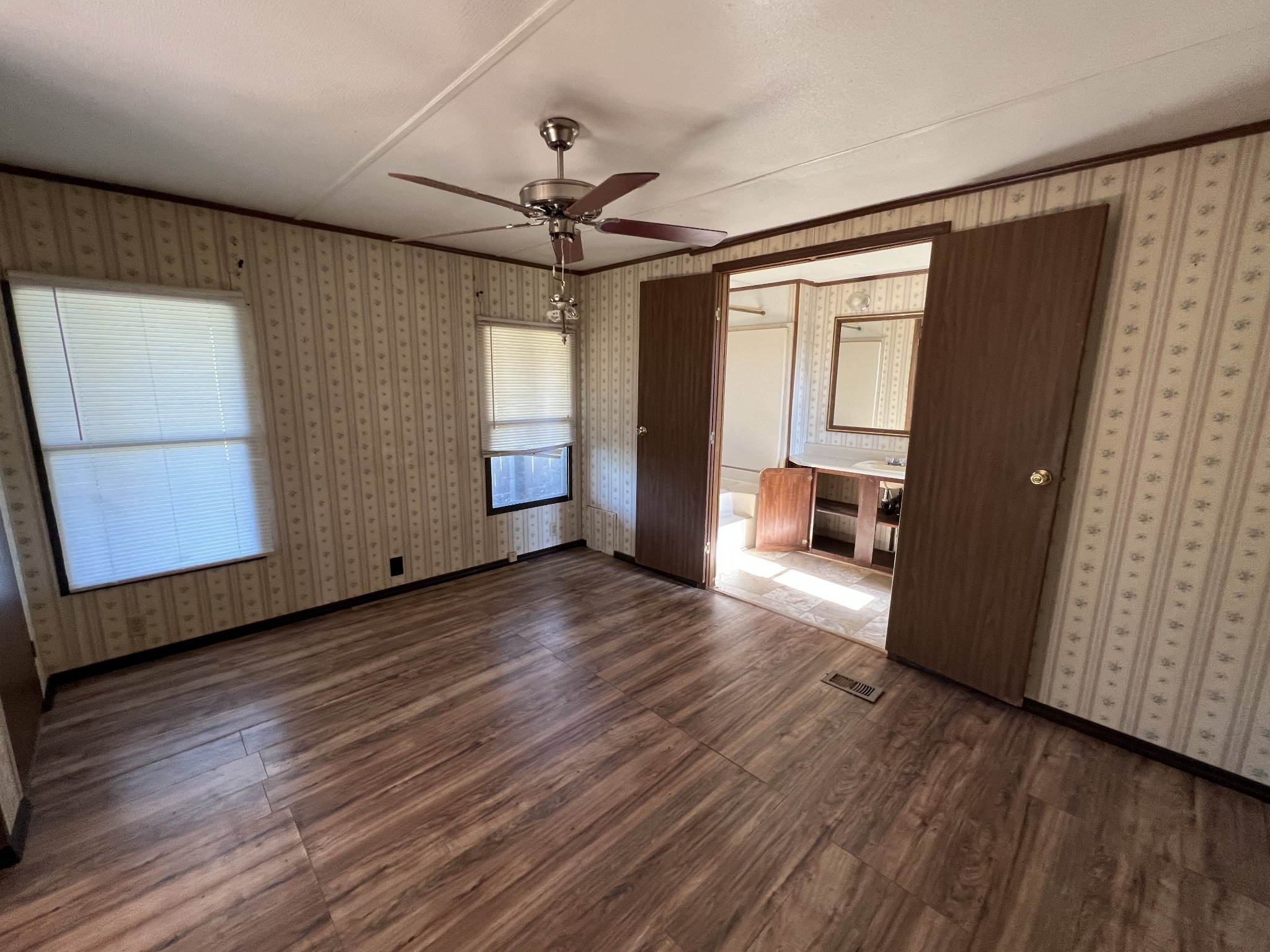 4225 Jernigan Road White House, TN 37188 - Photo 5 of 15 a view of an empty room with wooden floor and a window