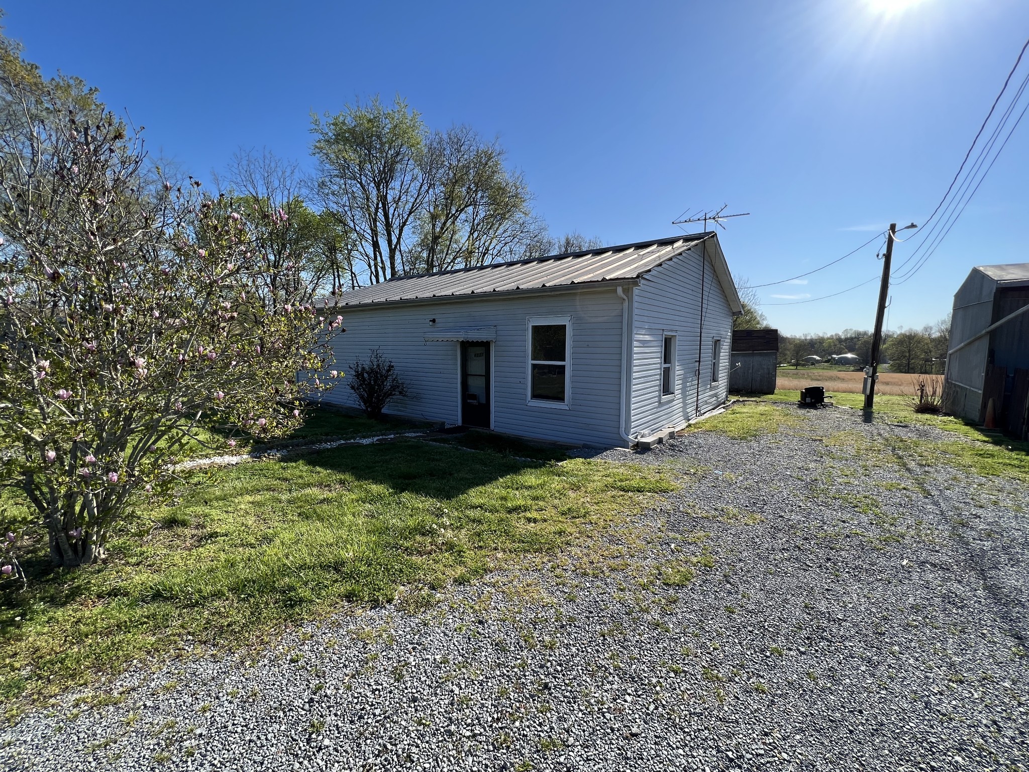 4225 Jernigan Road White House, TN 37188 - Photo 9 of 15 a backyard of a house with plants and tree