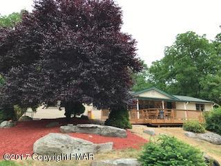 197 Devils Hole Road Cresco, PA 18326 - Photo 1 of 27 a front view of a house with yard