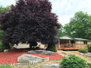 197 Devils Hole Road Cresco, PA 18326 - Photo 13 of 27 a view of a house with backyard porch and sitting area