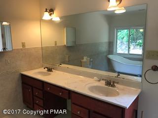 197 Devils Hole Road Cresco, PA 18326 - Photo 26 of 27 a bathroom with a sink double vanity and a mirror