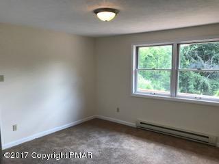 197 Devils Hole Road Cresco, PA 18326 - Photo 3 of 27 an empty room with a window
