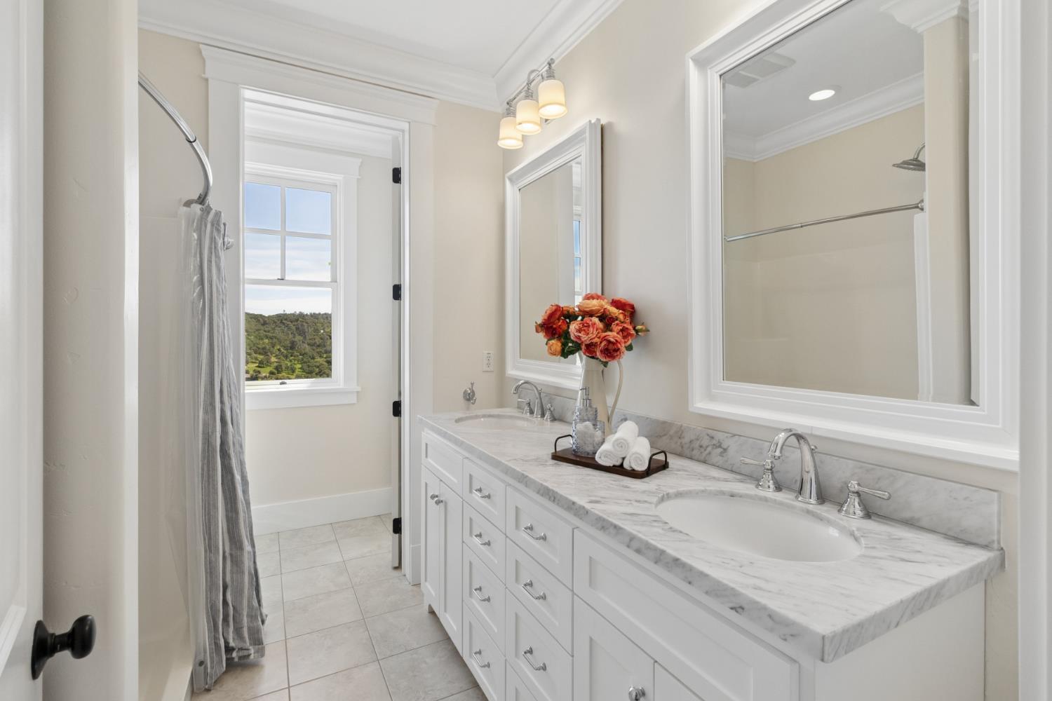 11015 Vintage Road Ione, CA 95640 - Photo 58 of 99 a bathroom with a granite countertop sink and a mirror