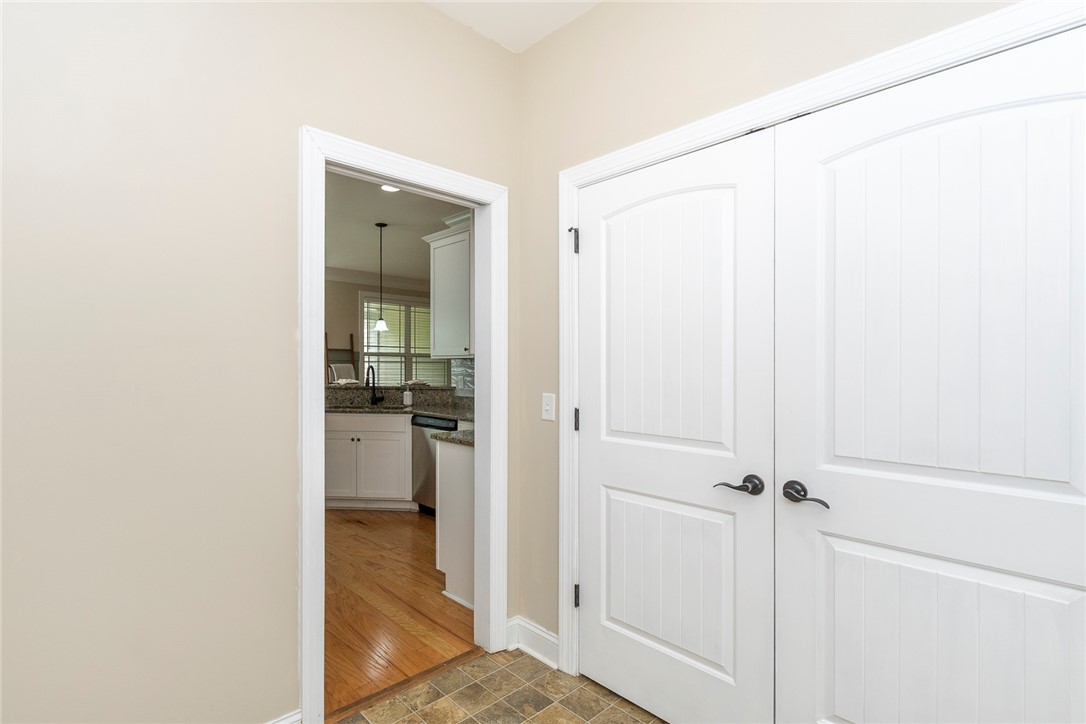 234 Streams Way Anderson, SC 29625 - Photo 37 of 44 This interior doorway provides a glimpse into a bright kitchen with elegant countertops.
