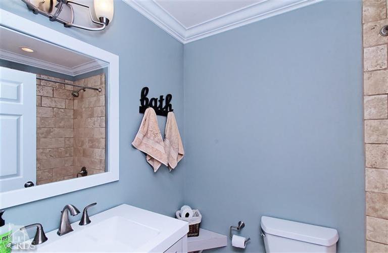 888 Appleton Road Simi Valley, CA 93065 - Photo 14 of 30 a bathroom with a toilet sink and shower