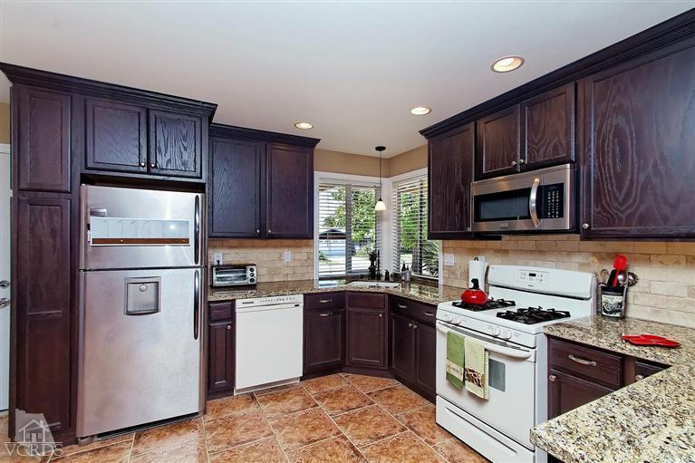 888 Appleton Road Simi Valley, CA 93065 - Photo 19 of 30 a kitchen with a sink stove and microwave