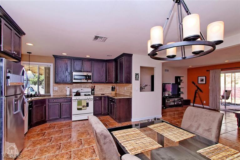 888 Appleton Road Simi Valley, CA 93065 - Photo 20 of 30 a kitchen with stainless steel appliances granite countertop a refrigerator a stove and a sink with chandelier