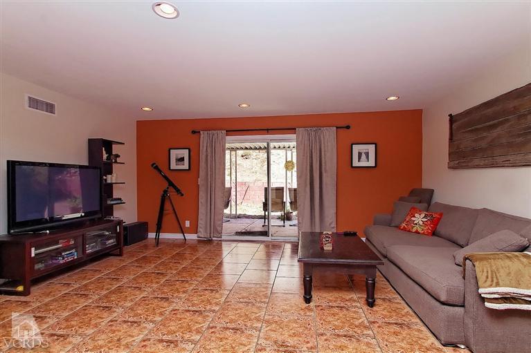 888 Appleton Road Simi Valley, CA 93065 - Photo 3 of 30 a living room with furniture and a flat screen tv