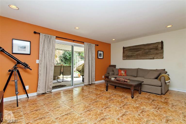 888 Appleton Road Simi Valley, CA 93065 - Photo 24 of 30 a living room with furniture and a floor to ceiling window