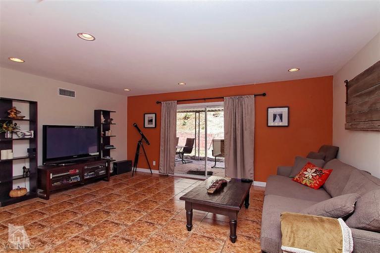 888 Appleton Road Simi Valley, CA 93065 - Photo 25 of 30 a living room with furniture a flat screen tv and a window