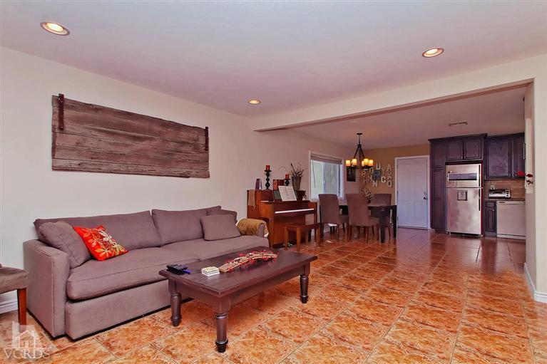 888 Appleton Road Simi Valley, CA 93065 - Photo 26 of 30 a living room with furniture and a dining table with kitchen view