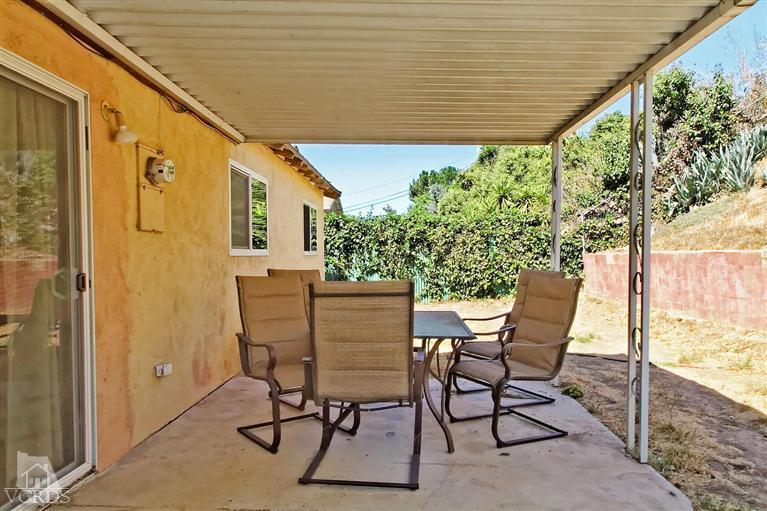 888 Appleton Road Simi Valley, CA 93065 - Photo 28 of 30 a patio with table and chairs and potted plants