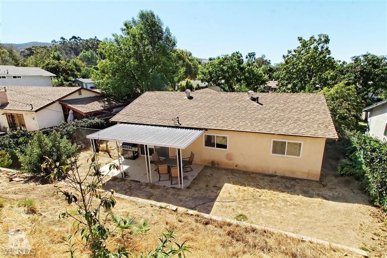 888 Appleton Road Simi Valley, CA 93065 - Photo 30 of 30 a view of a patio with a table and chairs under an umbrella