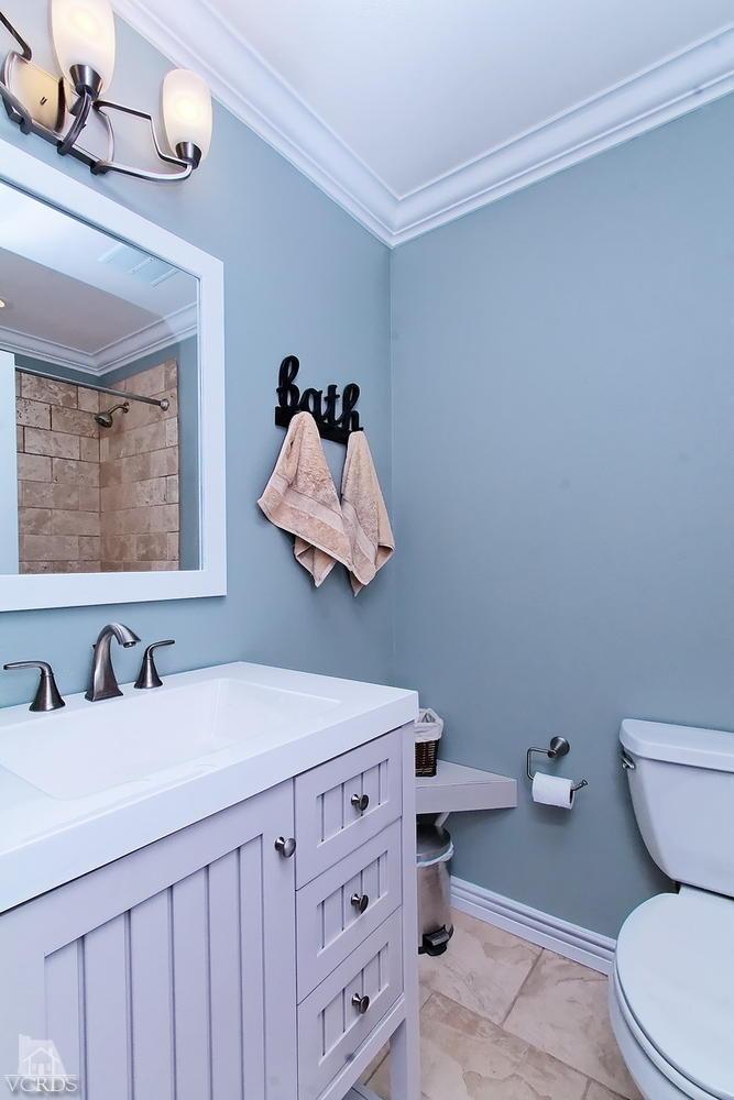 888 Appleton Road Simi Valley, CA 93065 - Photo 4 of 30 a bathroom with a sink a toilet and mirror