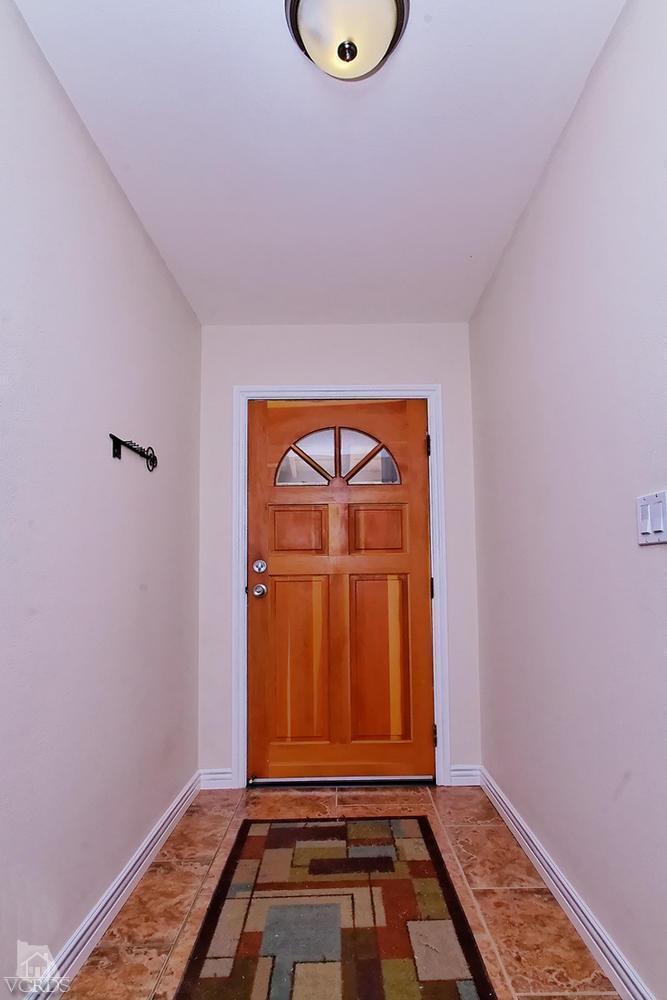 888 Appleton Road Simi Valley, CA 93065 - Photo 9 of 30 a view of a room with wooden floor and white walls