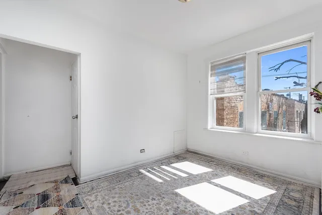 a view of a bedroom with a window