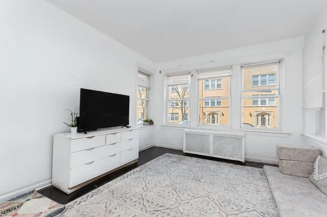 a living room with furniture and flat screen tv