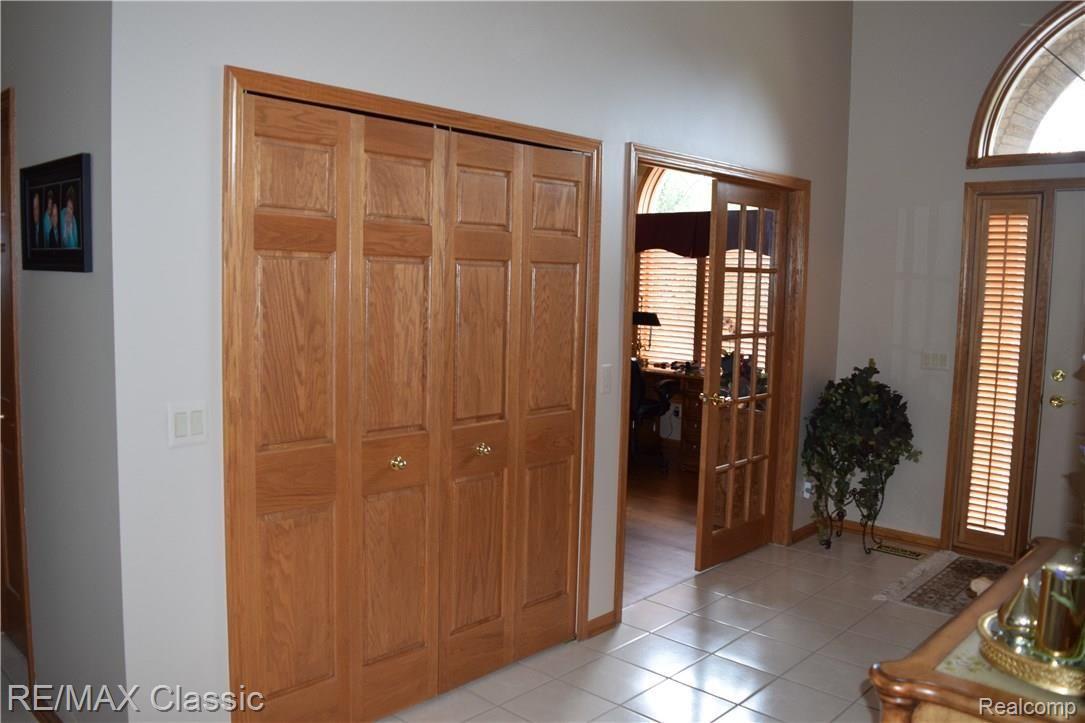 9495 Quail Ridge Run Brighton, MI 48114 - Photo 10 of 85 Solid Oak Doors Throughout! Quality Abounds!