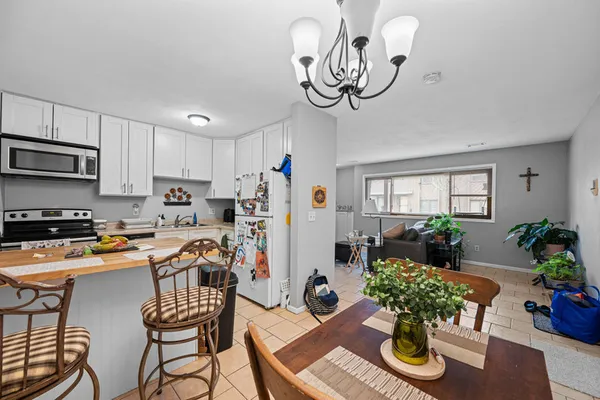a view of a dining room with furniture window and flowerpot