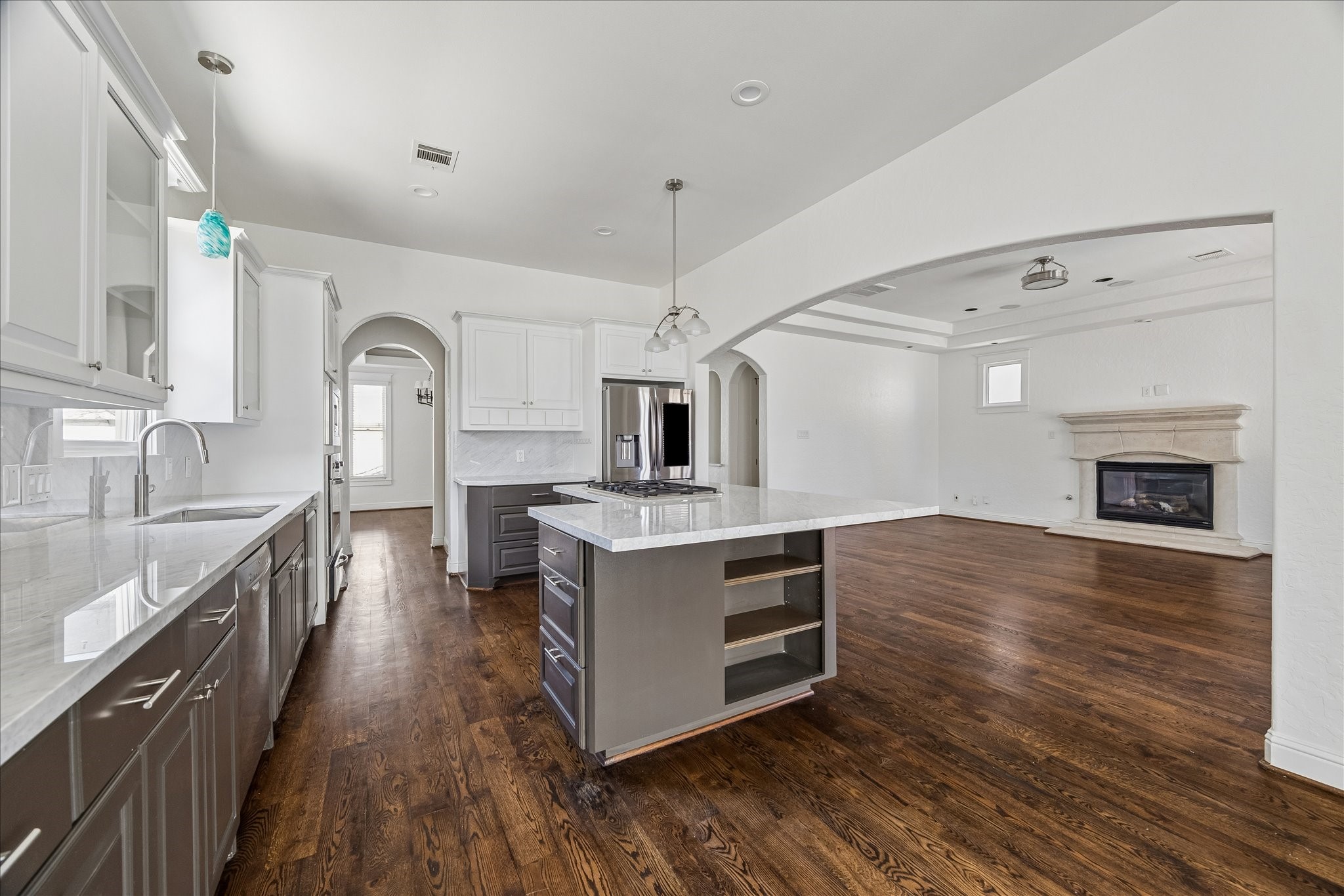 1408 West 23rd Street Houston, TX 77008 - Photo 15 of 39 a kitchen with stainless steel appliances a stove top oven and sink