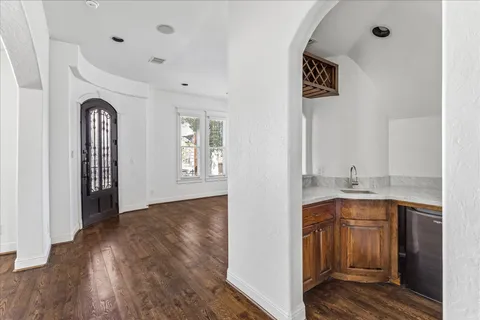 a kitchen with granite countertop a sink and cabinets