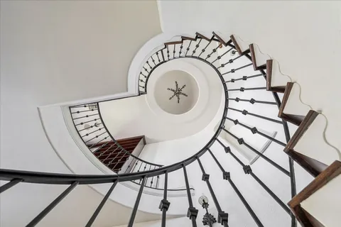 a view of entryway and hall with a chandelier