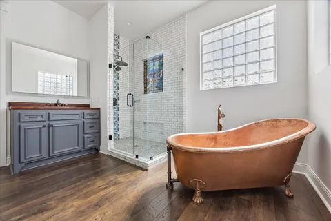 a bathroom with a granite countertop toilet sink and mirror