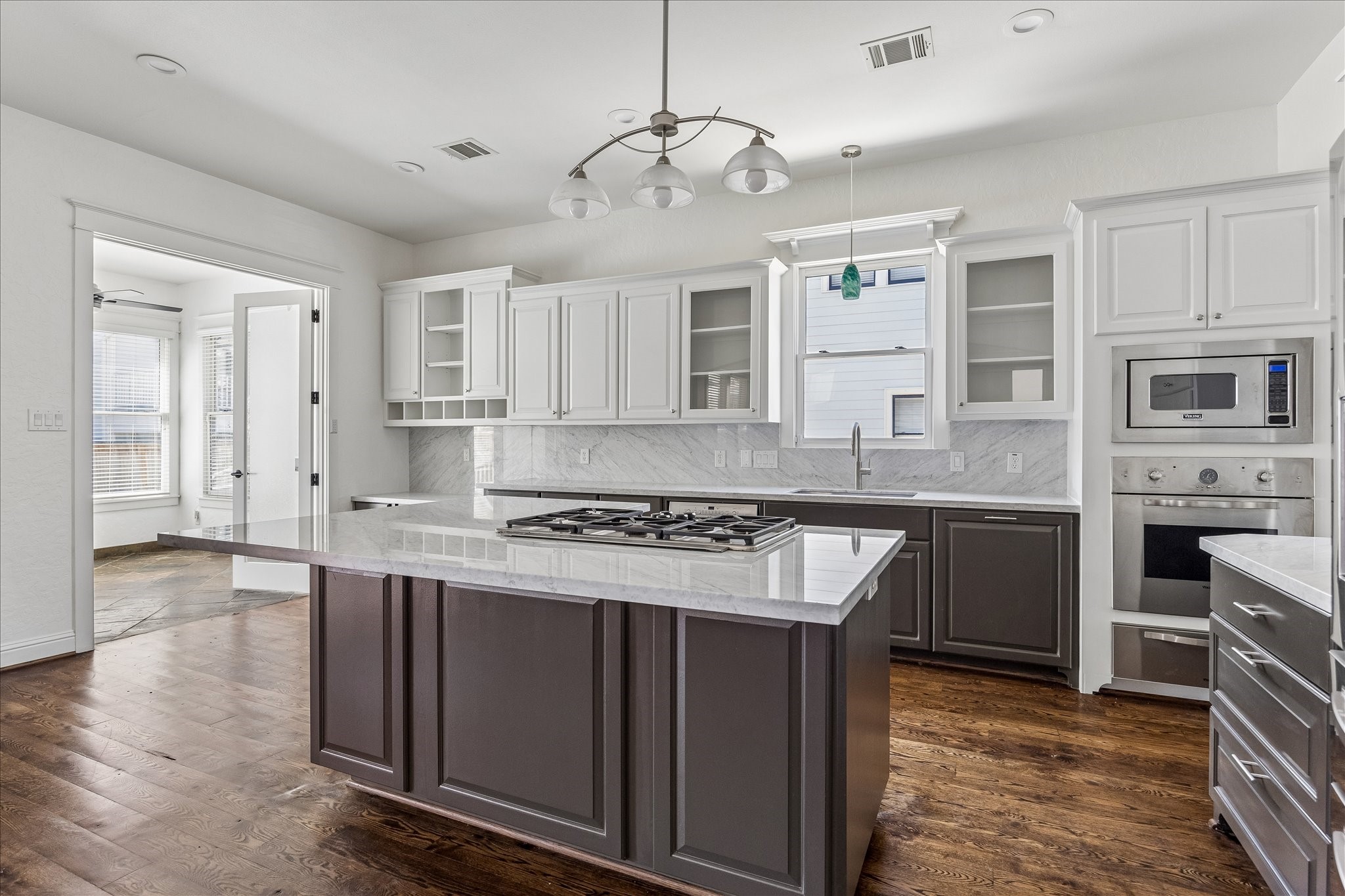1408 West 23rd Street Houston, TX 77008 - Photo 3 of 39 a kitchen with stainless steel appliances granite countertop a stove and a sink