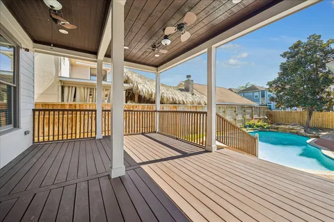 a view of a swimming pool with a yard