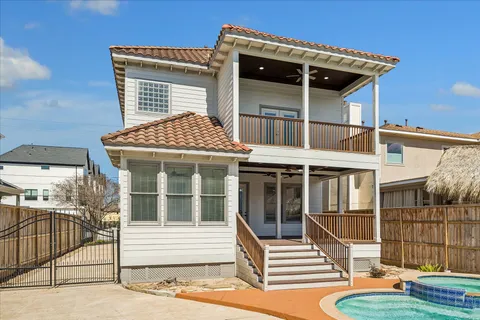 a front view of a house with a iron gate