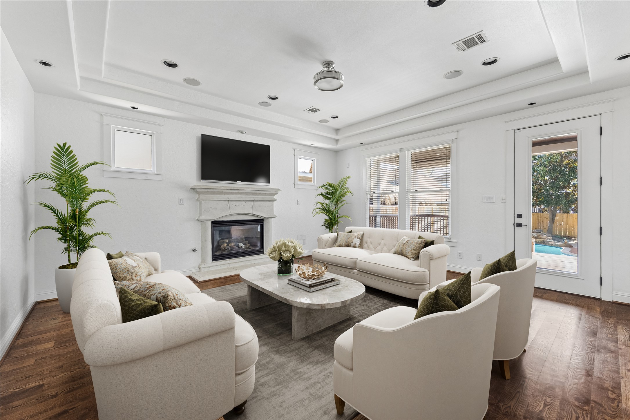 1408 West 23rd Street Houston, TX 77008 - Photo 4 of 39 a living room with furniture a flat screen tv and a fireplace