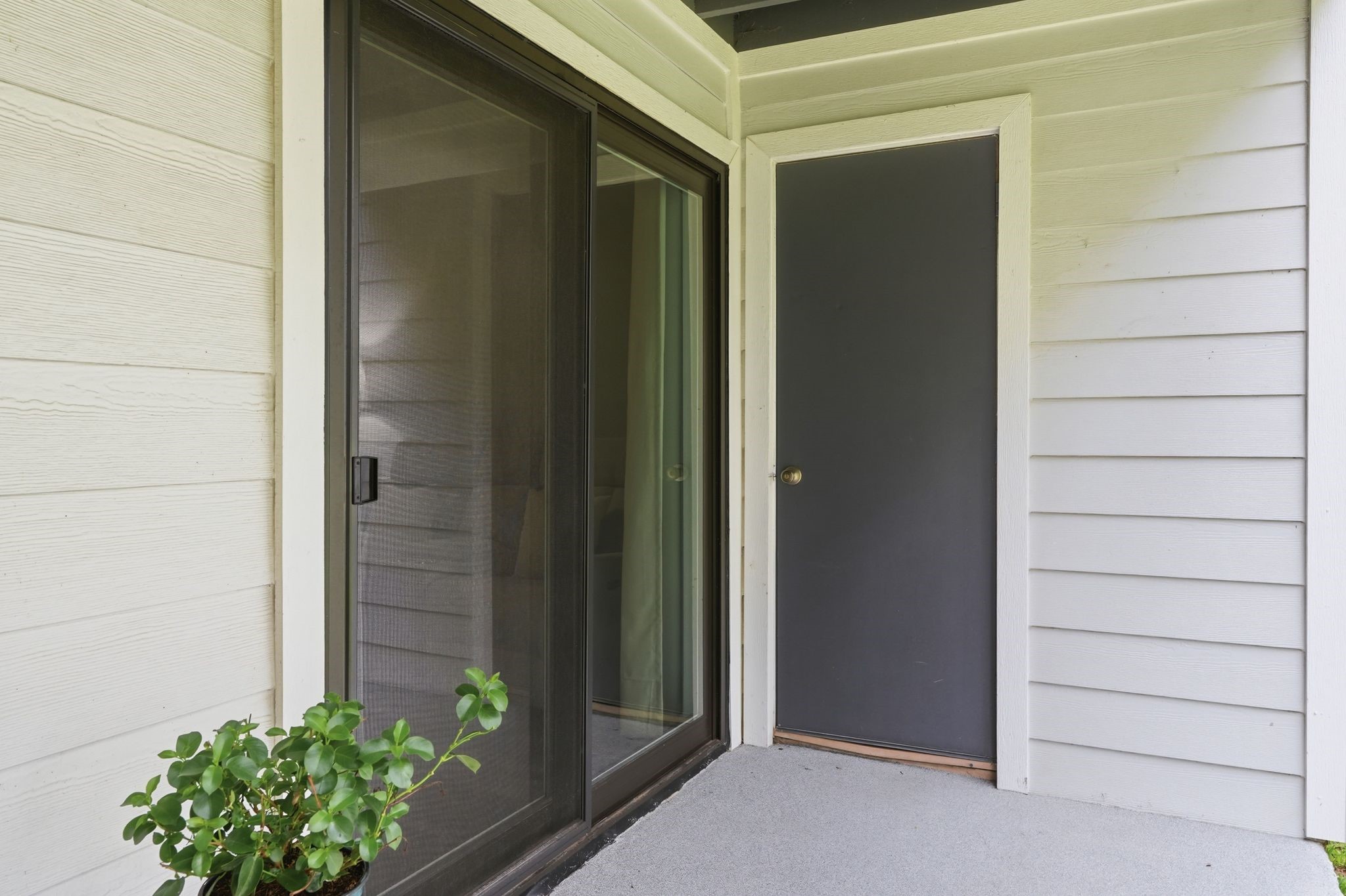 13151 Walden Road, Unit 131 Montgomery, TX 77356 - Photo 17 of 35 Welcoming patio entrance with views of the surrounding green space.