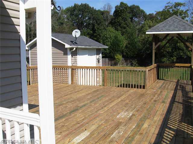 6625 Liberty Road Julian, NC 27283 - Photo 14 of 15 Patio/Deck. Photo of deck and storage building. Covered area could really come in handy while grilling in a rain shower.