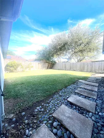 a view of a yard with an outdoor space