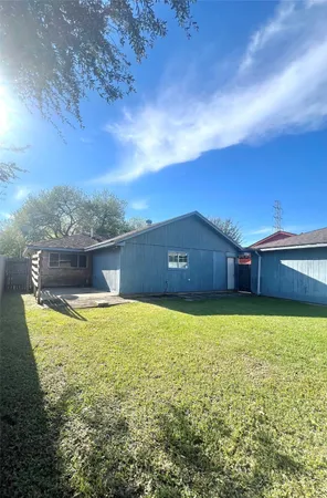 a house with pool in front of it