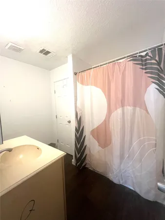 a bathroom with a sink and mirror