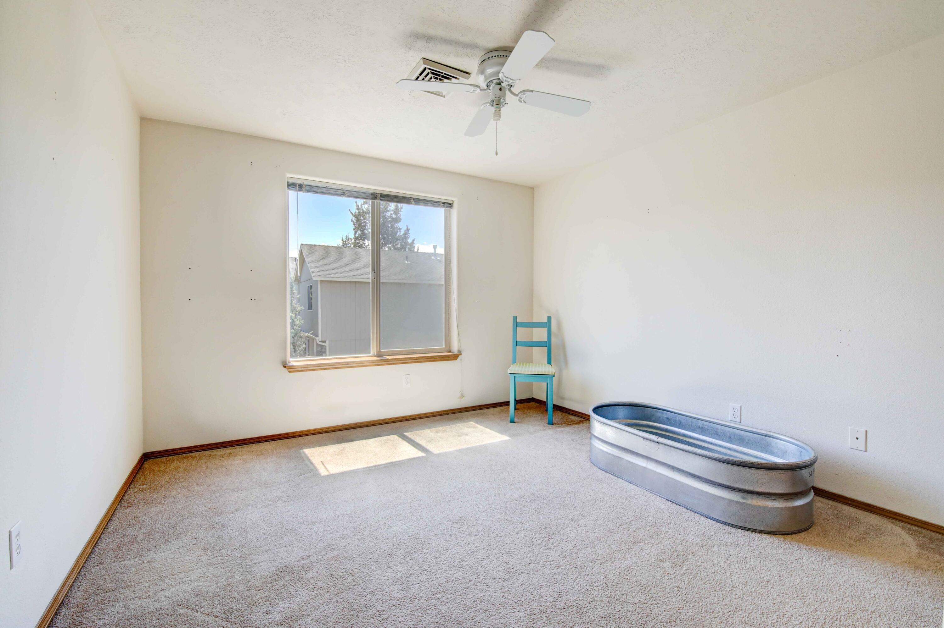 1446 Southwest 16th Street Redmond, OR 97756 - Photo 14 of 17 Second bedroom is also good sized and has a ceiling fan.