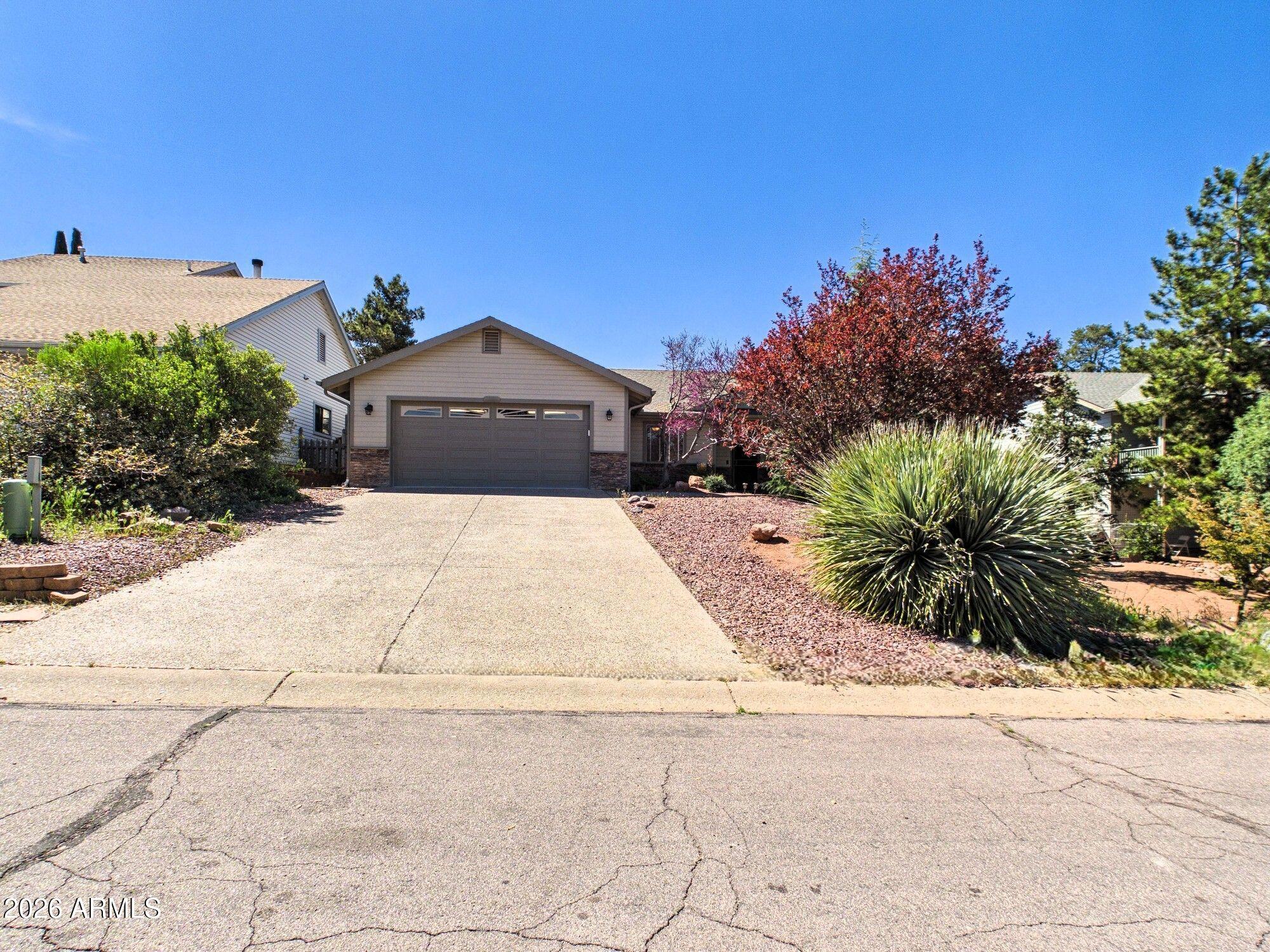1104 North Rhone Circle Payson, AZ 85541 - Photo 1 of 39 a front view of a house with a yard