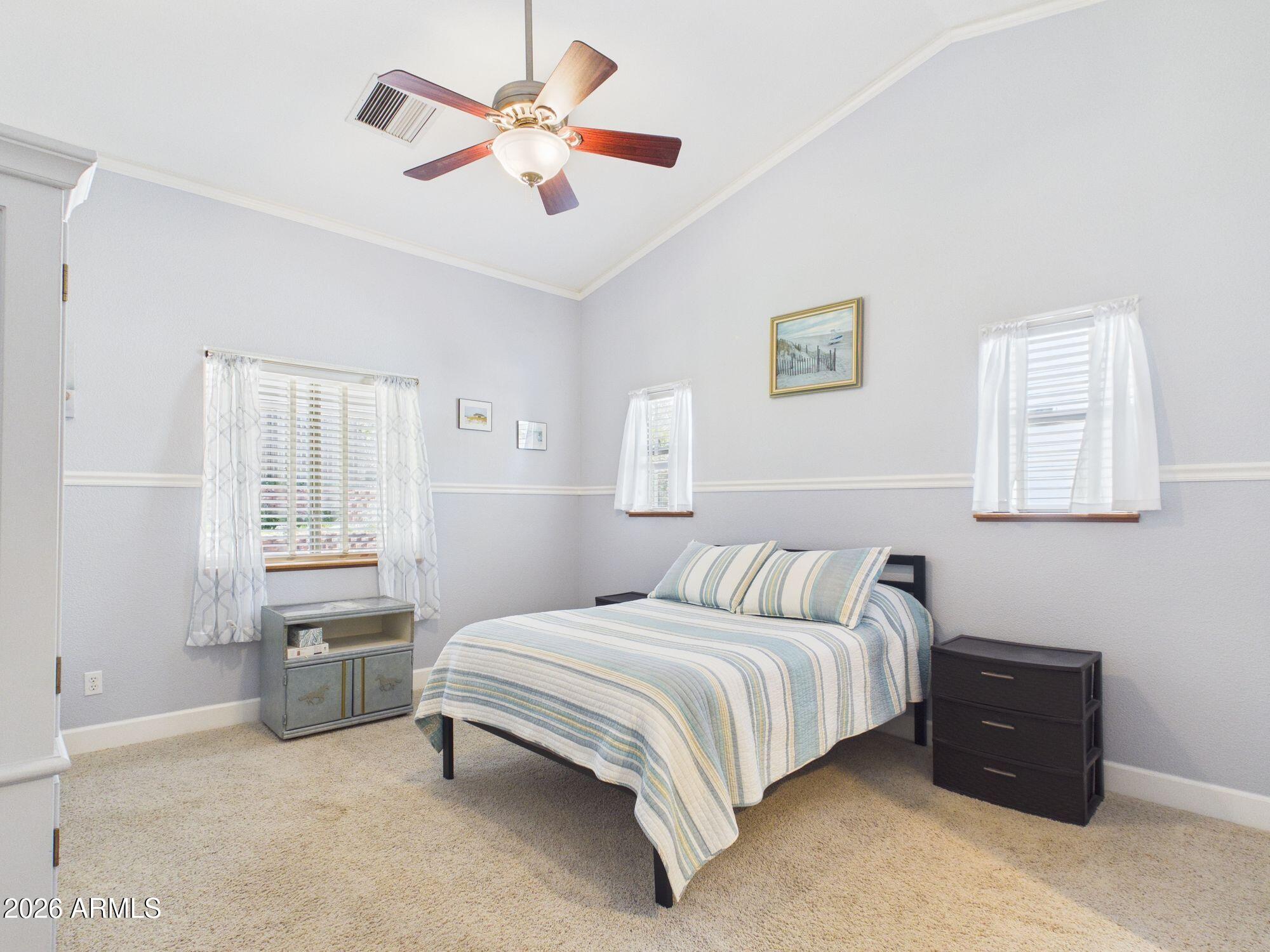 1104 North Rhone Circle Payson, AZ 85541 - Photo 12 of 39 a bedroom with a bed dresser and window