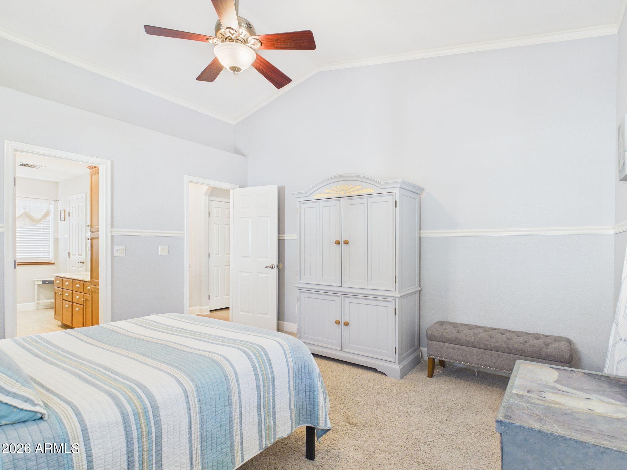 1104 North Rhone Circle Payson, AZ 85541 - Photo 13 of 39 a bedroom with a bed and a chandelier