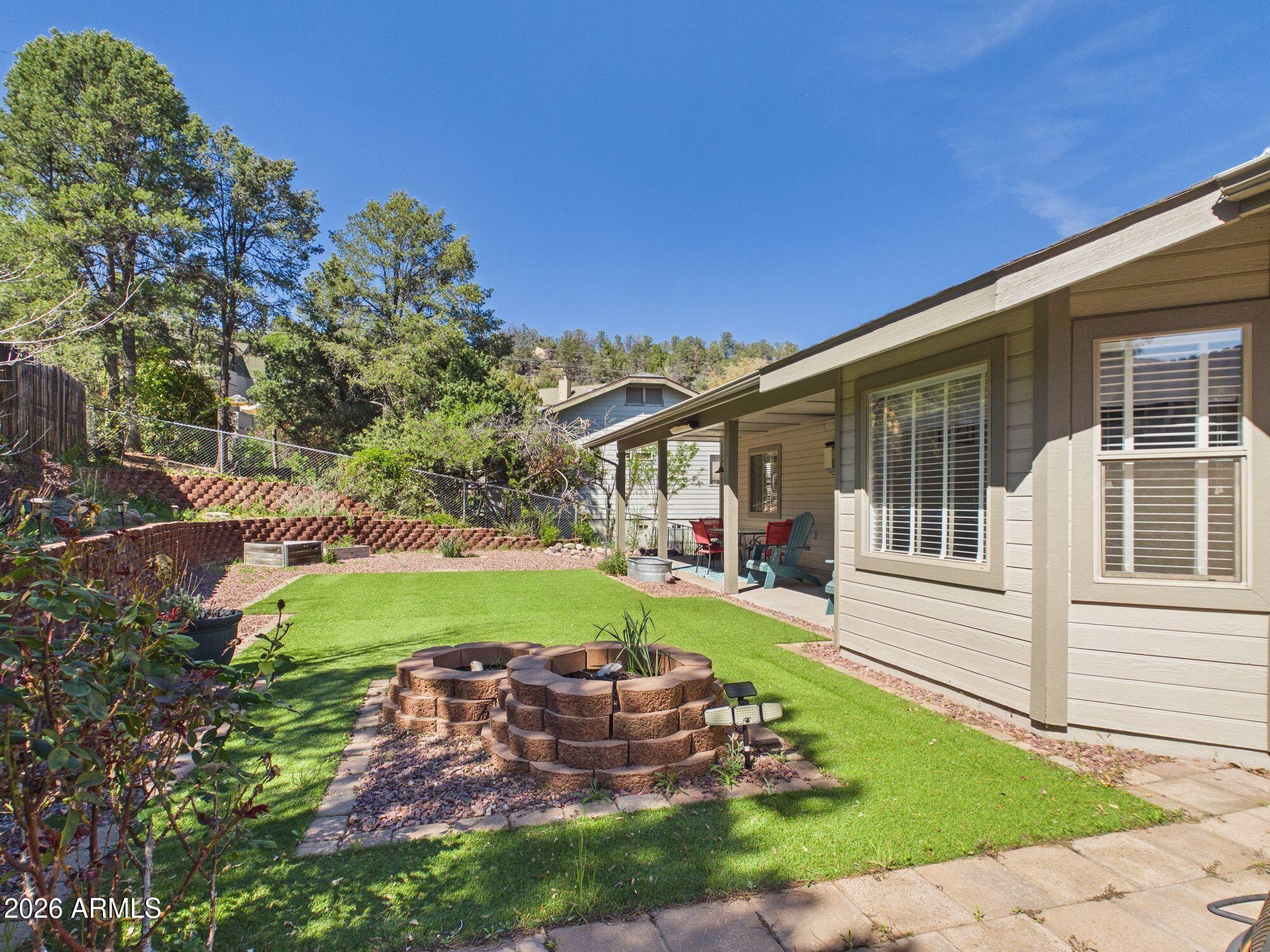 1104 North Rhone Circle Payson, AZ 85541 - Photo 21 of 39 a front view of a house with garden