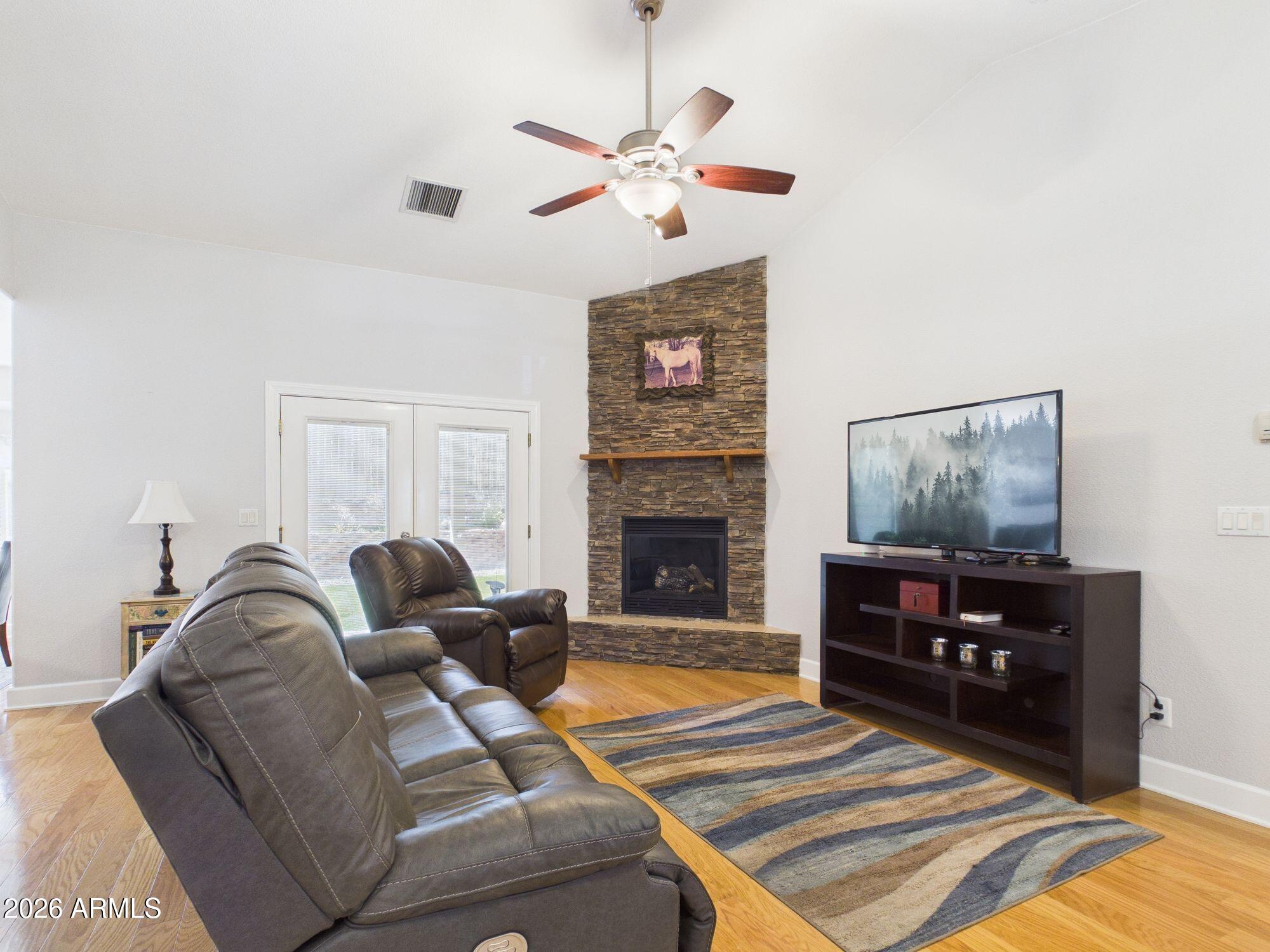 1104 North Rhone Circle Payson, AZ 85541 - Photo 5 of 39 a living room with furniture and a fireplace