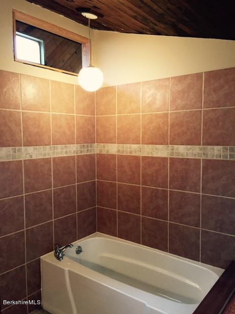 117 Middlefield Road Peru, MA 01235 - Photo 12 of 18 a bathroom with a bathtub