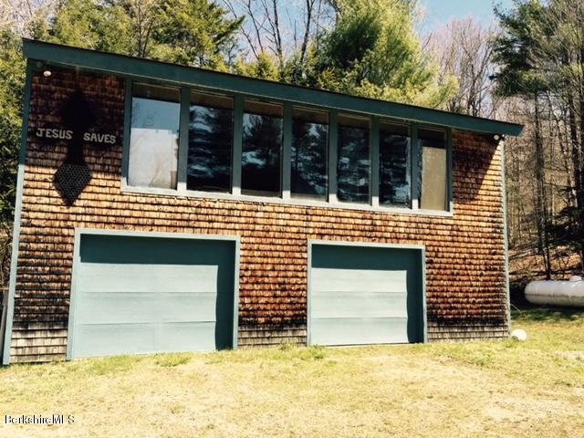 117 Middlefield Road Peru, MA 01235 - Photo 3 of 18 a front view of a house with a garage