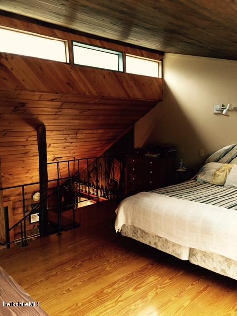 117 Middlefield Road Peru, MA 01235 - Photo 9 of 18 a bedroom with a bed next to a window