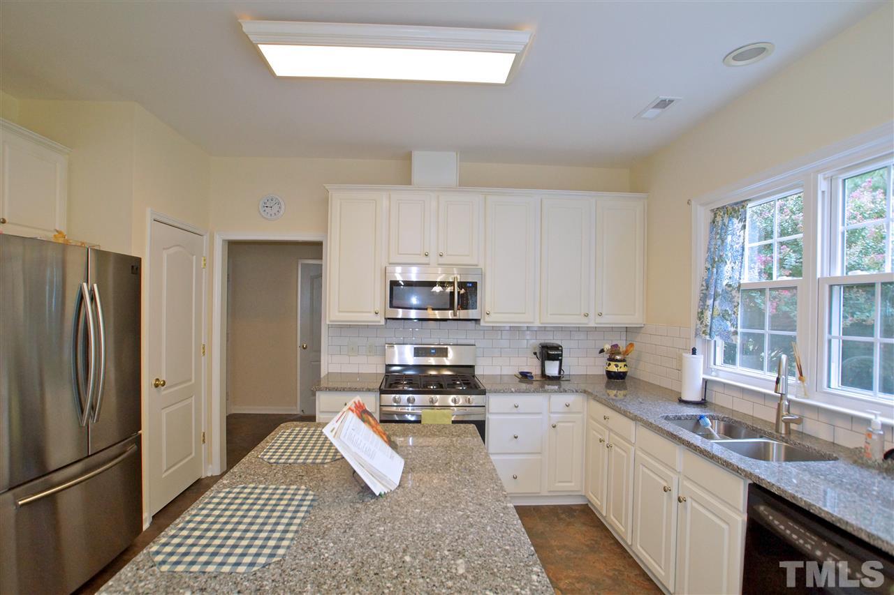 7540 Silver View Lane Raleigh, NC 27613 - Photo 13 of 29 Granite countertops and stainless steel appliances.