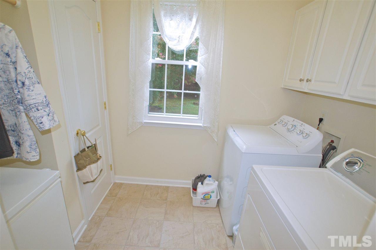 7540 Silver View Lane Raleigh, NC 27613 - Photo 16 of 29 Laundry/Mud room with plenty of cabinet storage.