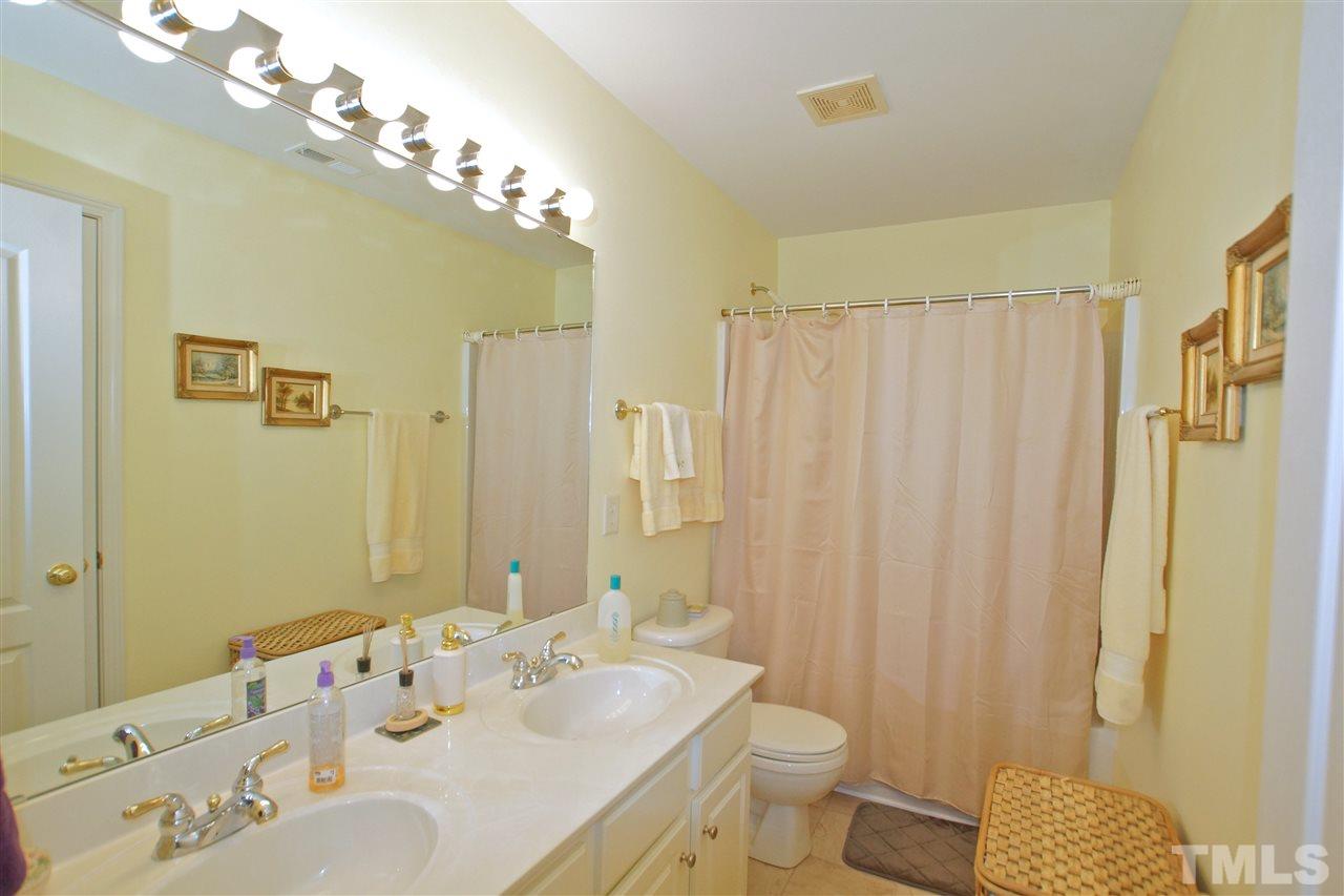 7540 Silver View Lane Raleigh, NC 27613 - Photo 20 of 29 Full bathroom on second floor with double sink vanity.