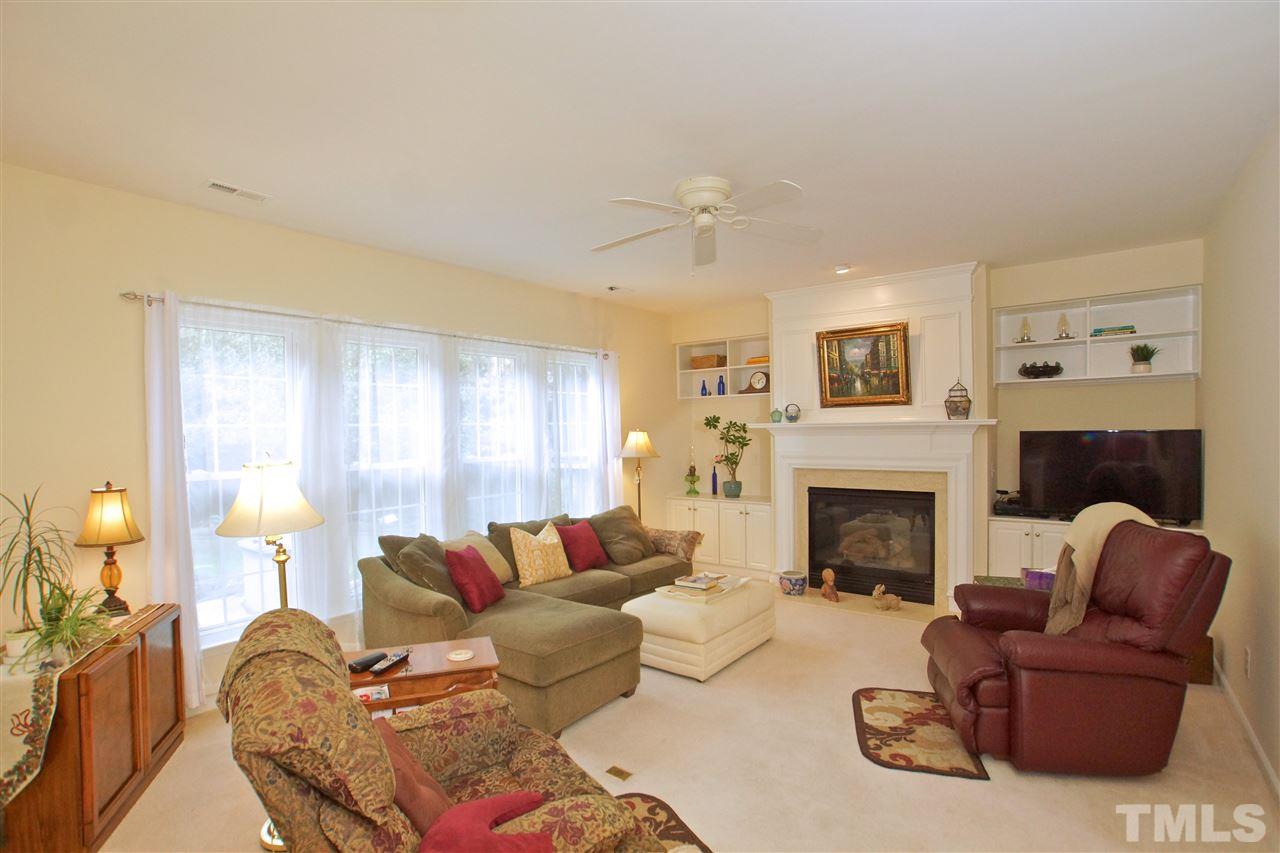 7540 Silver View Lane Raleigh, NC 27613 - Photo 7 of 29 Spacious family room with fireplace. Great spot to relax and unwind after a busy day.